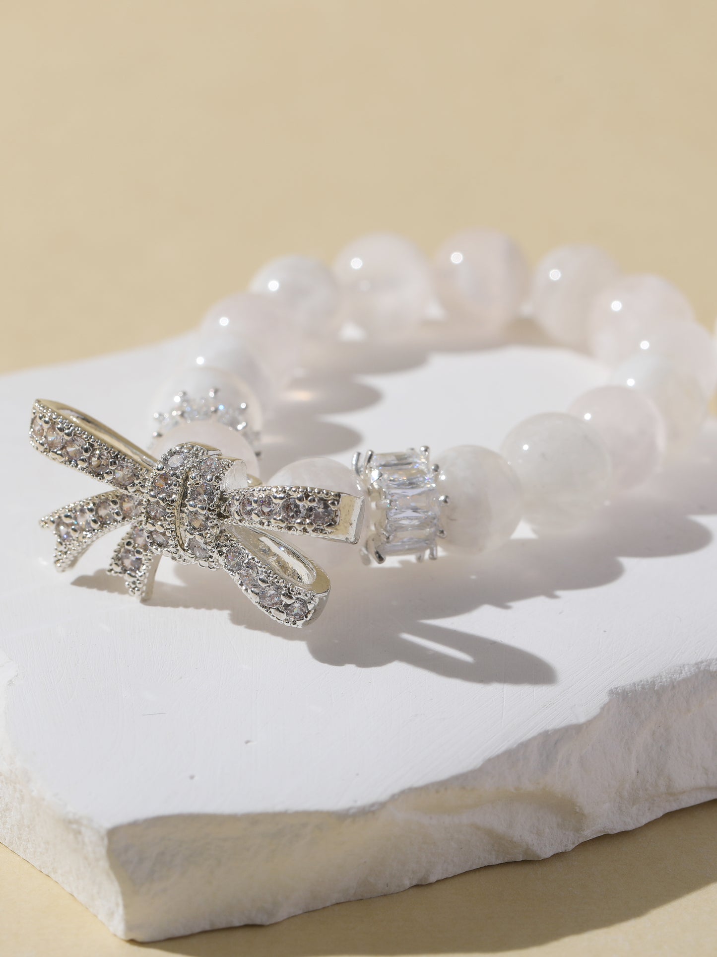 White Snowflake Stone Bracelet with Bow Charm