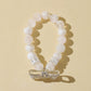 White Snowflake Stone Bracelet with Bow Charm