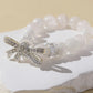 White Snowflake Stone Bracelet with Bow Charm