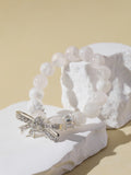 White Snowflake Stone Bracelet with Bow Charm